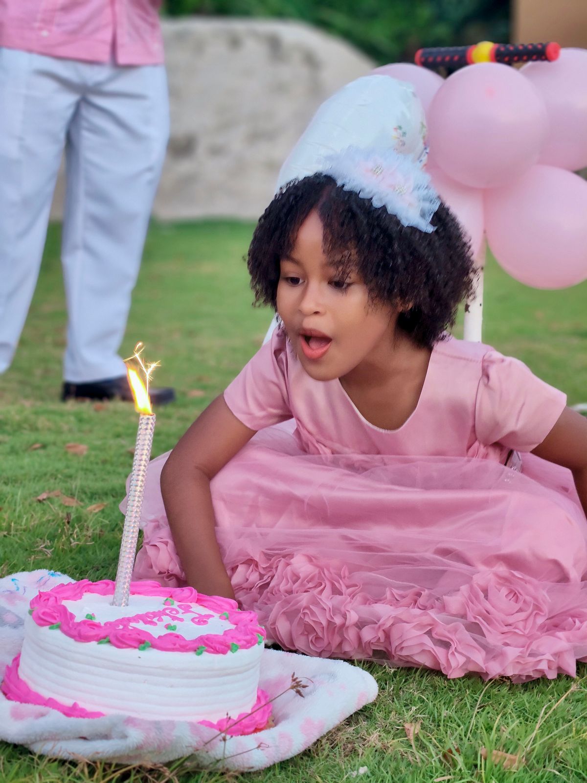 Child's birthday party with cake and balloons