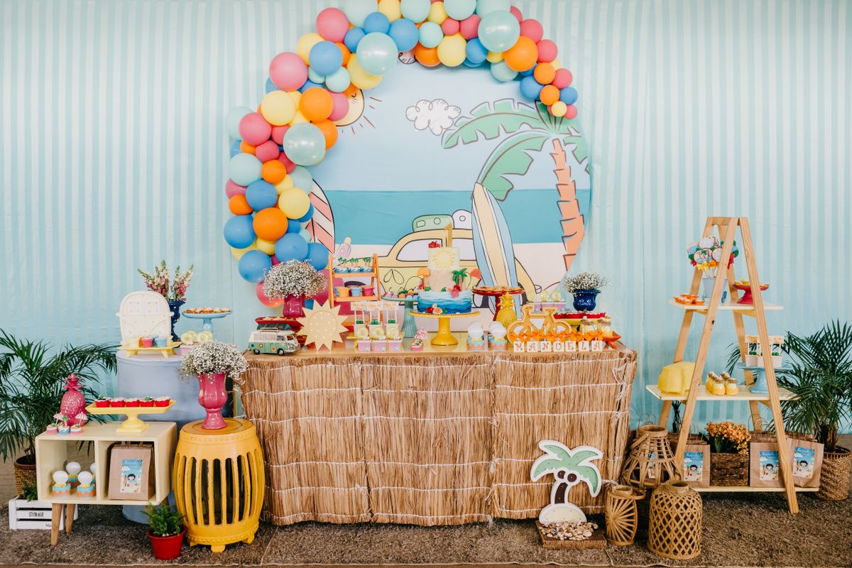 Backyard birthday party fully set up with balloons and decorations